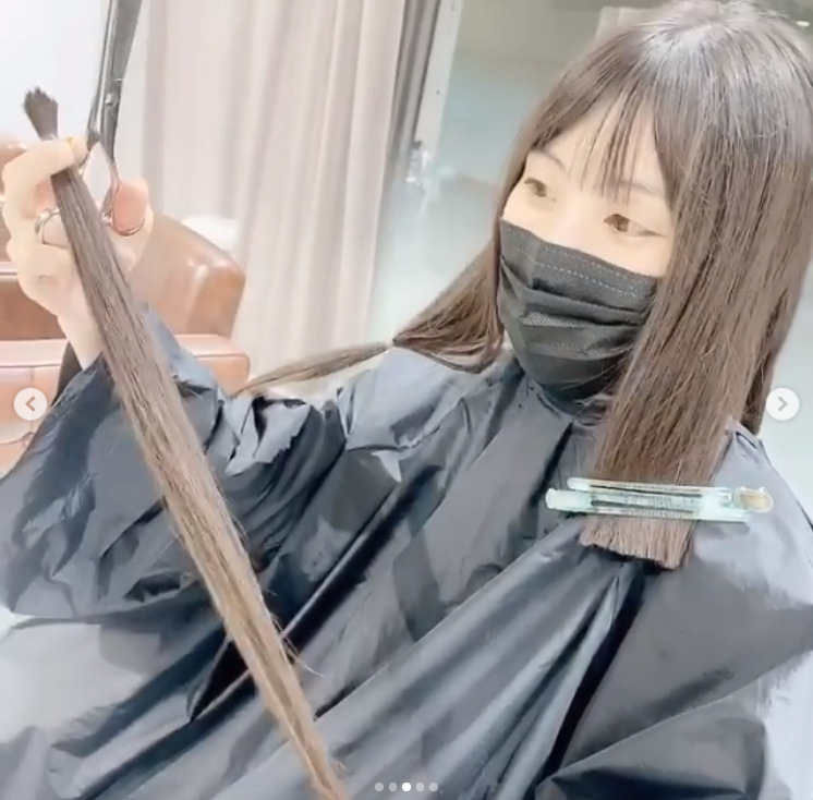 Aoi Koga with a part of her hair.