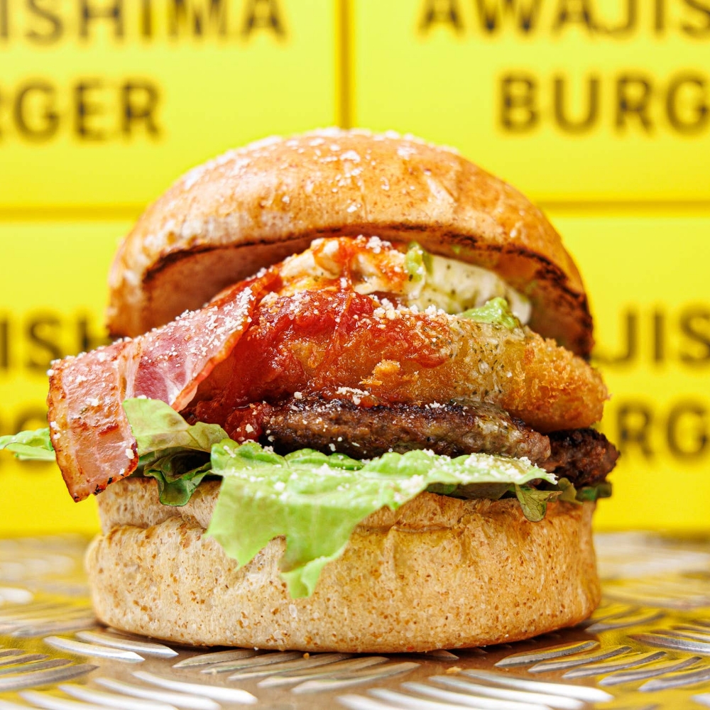 A Shimauma Burger regular menu item, the Awajishima Basil and Cream Cheese Burger